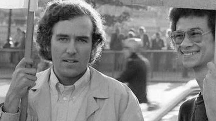 Peter Hain holding a placard on a demonstration in the early 1970s